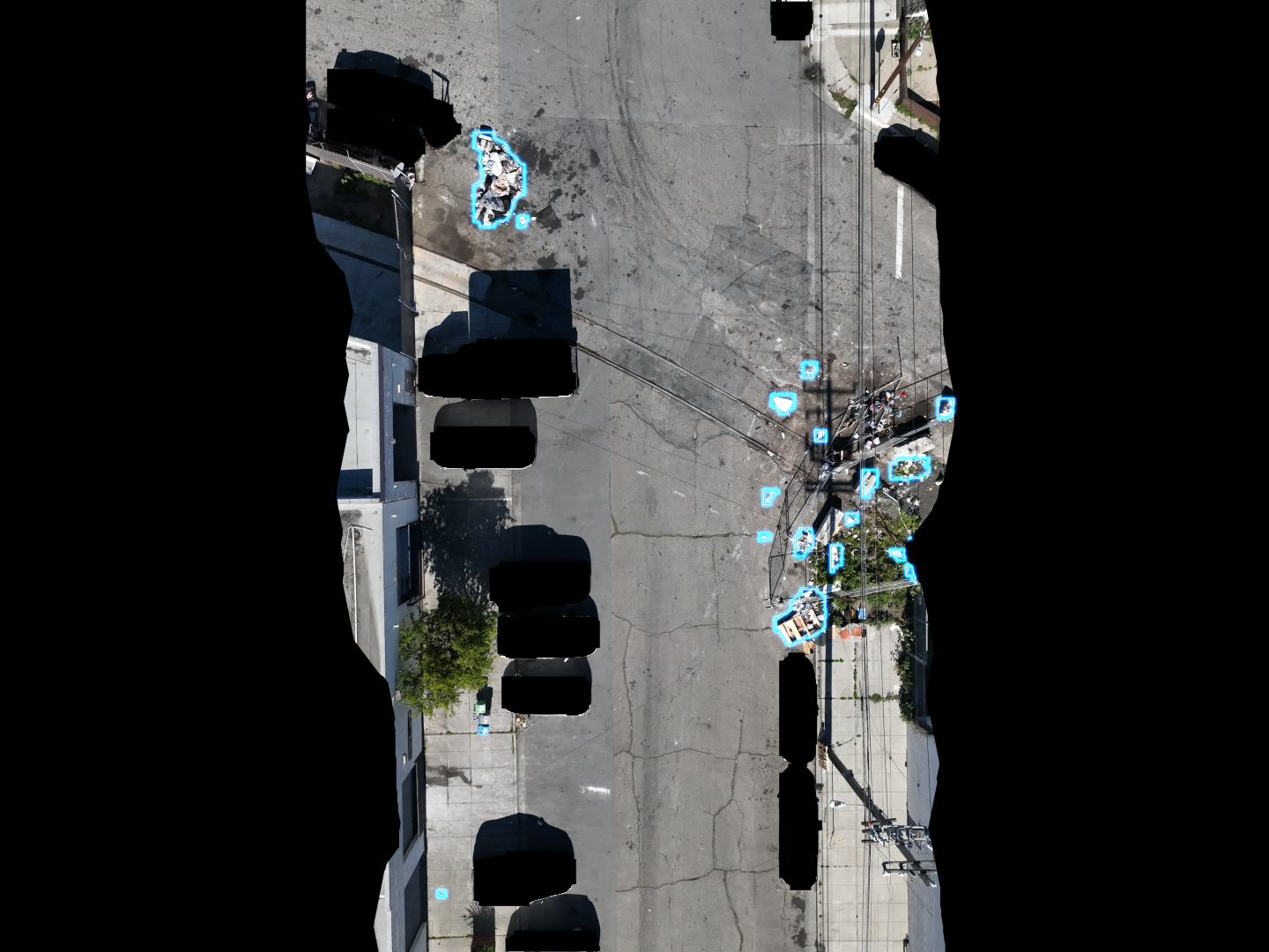 AI detection with segmentation masks identifying illegal dumping from aerial imagery